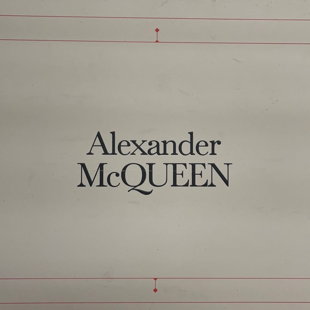 Slightly worn A McQueen. Comes with dust bag